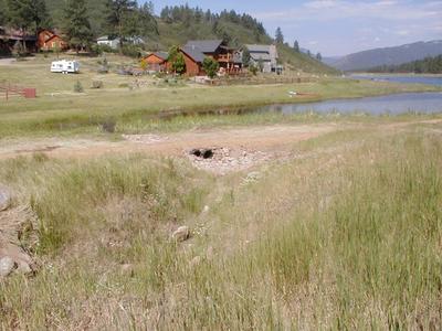 Brown crops with red buildings