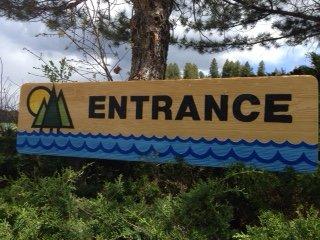 Sign with Entrance painted on it